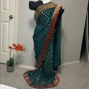 Saree green and black blouse.
